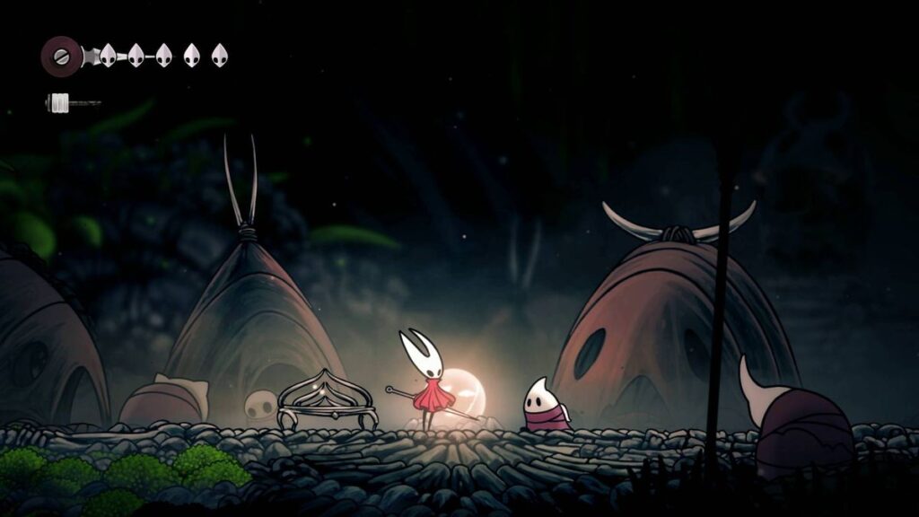 Hornet vicino a Shakra in una caverna di The Marrow Gamescafe Hornet vicino a Shakra in una caverna di The Marrow