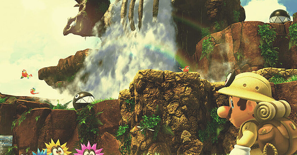 Super Mario Odyssey Fossil Falls Nintendo Gamescafe Mario osserva il Cascade Kingdom con le cascate sullo sfondo